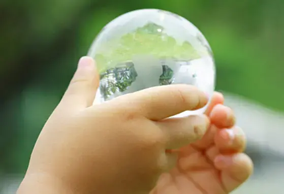 Sustainability Portal Thumbnail - child with globe
